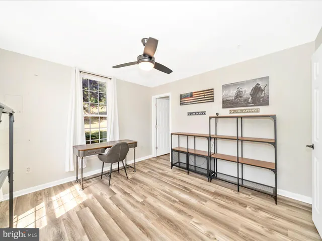 a view of a livingroom with furniture and windows