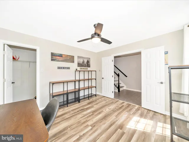 a view of a livingroom with furniture and stairs