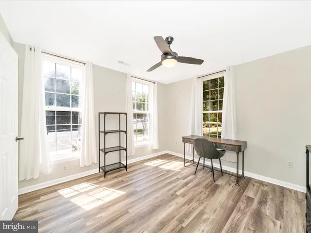 a view of a livingroom with furniture and windows