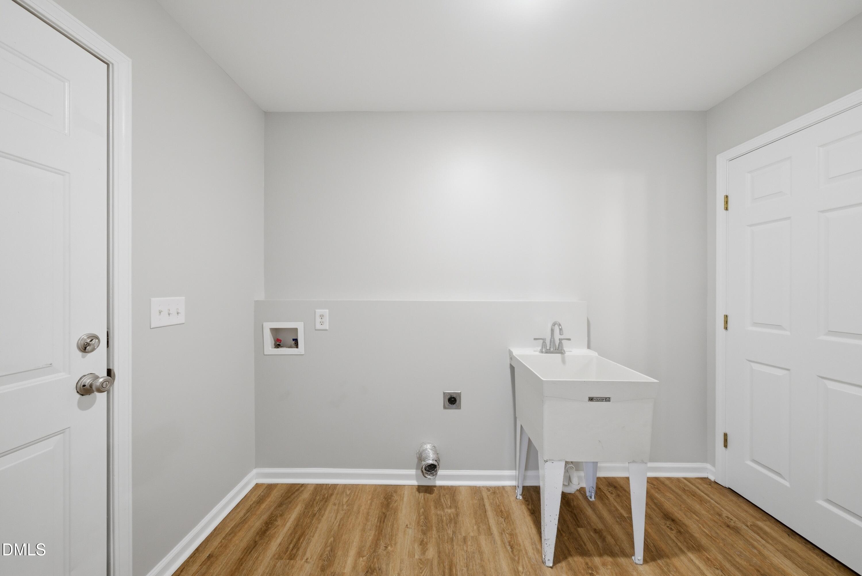 201 Tonylee Court, Unit A Raleigh, NC 27603 - Photo 18 of 30 a view of small space with wooden floor and sink