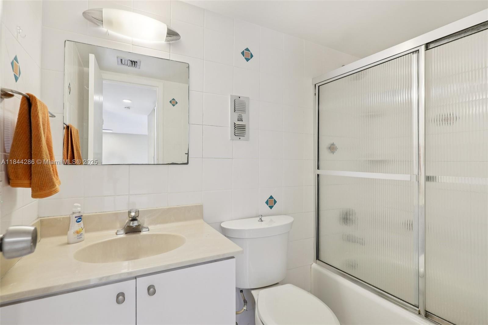 14170 Southwest 84th Street, Unit 501F Miami, FL 33183 - Photo 13 of 26 a bathroom with a sink toilet and shower