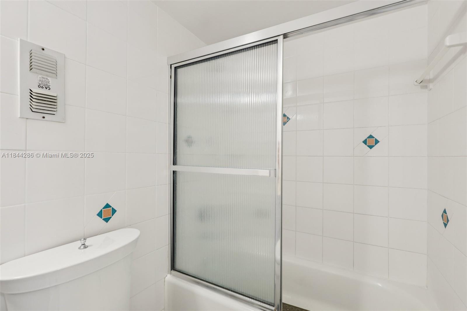 14170 Southwest 84th Street, Unit 501F Miami, FL 33183 - Photo 14 of 26 a bathroom with a bathtub and a shower