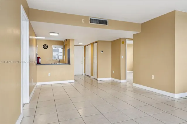 a view of a hallway with wooden shelves