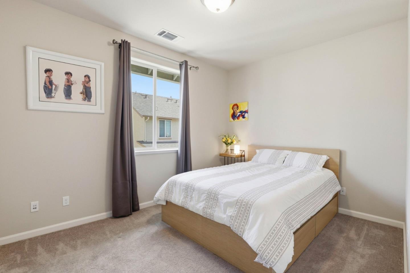 187 Springtime Circle Hollister, CA 95023 - Photo 11 of 19 a bedroom with a bed and wooden floor