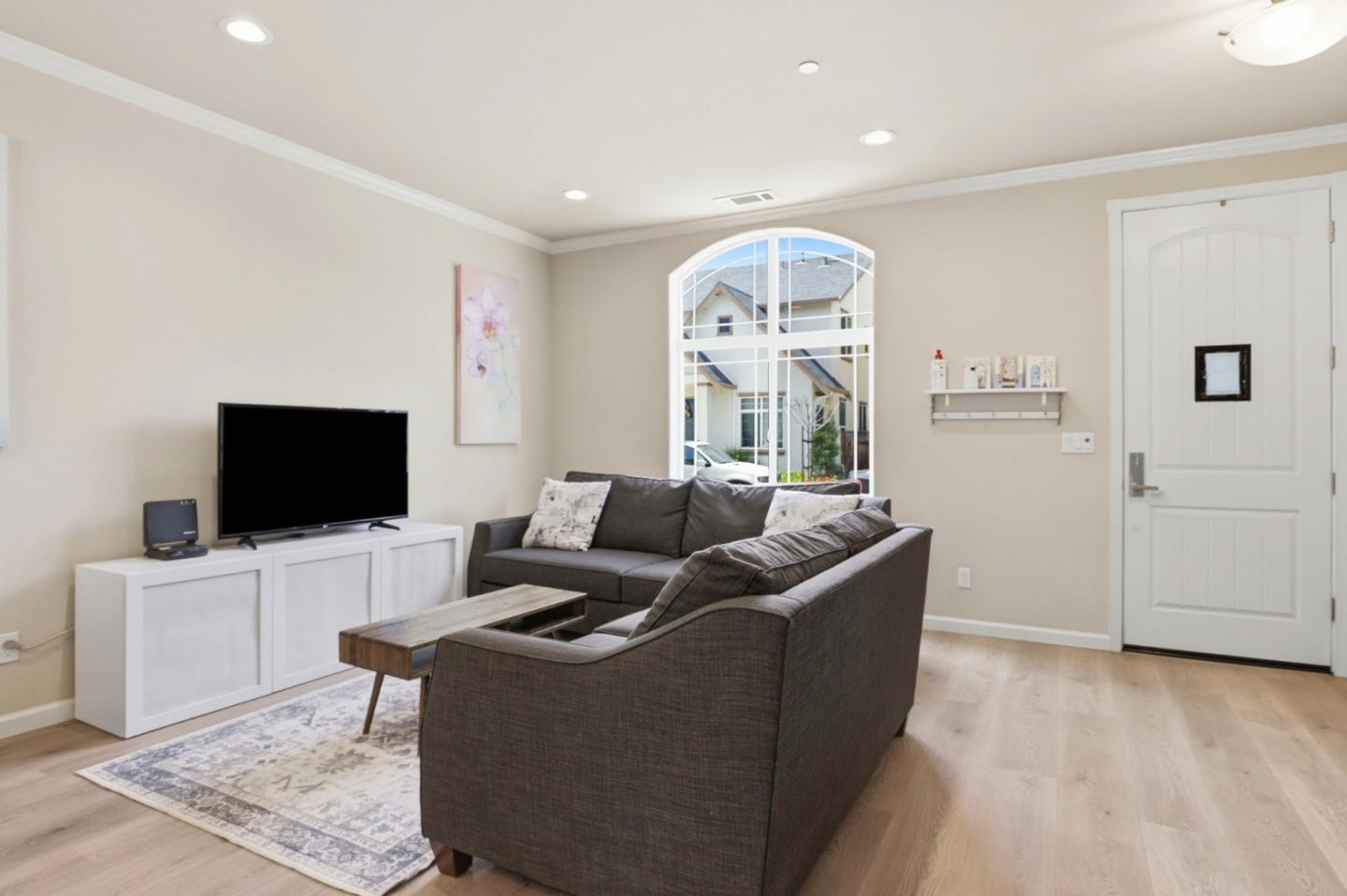 187 Springtime Circle Hollister, CA 95023 - Photo 6 of 19 a living room with furniture and a flat screen tv