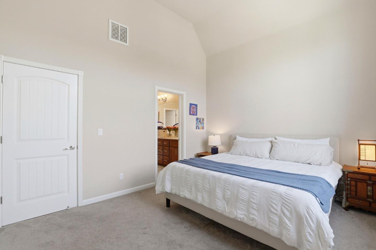 187 Springtime Circle Hollister, CA 95023 - Photo 8 of 19 a bedroom with a bed and a night stand