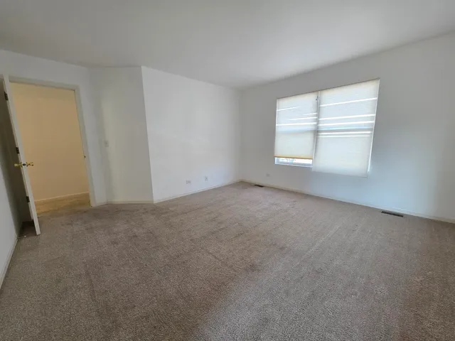 a bathroom with a double vanity sink toilet and shower