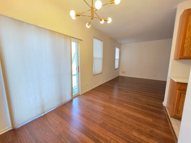 a kitchen with stainless steel appliances granite countertop a sink and a stove
