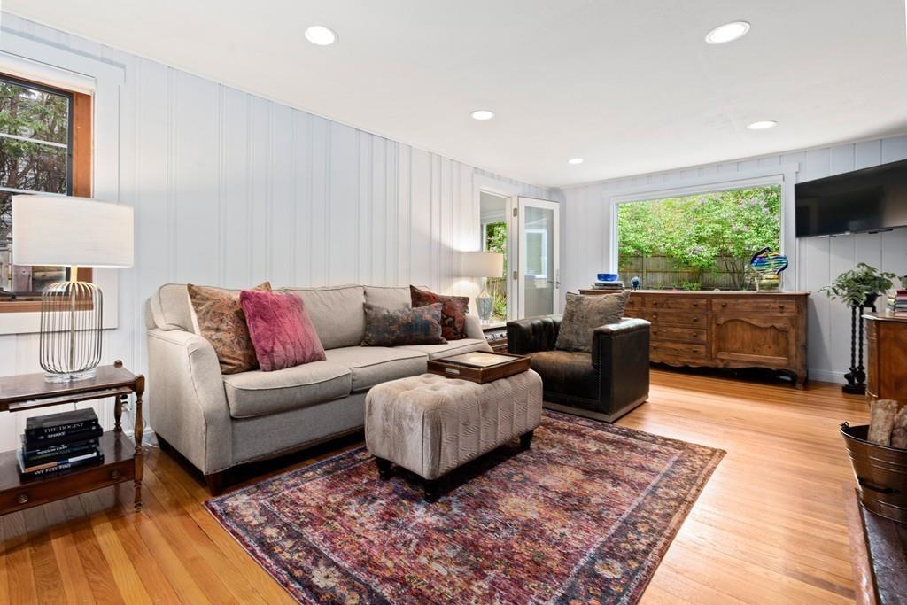69 Margaret Road Newton, MA 02461 - Photo 3 of 24 a living room with furniture flat screen tv and a rug