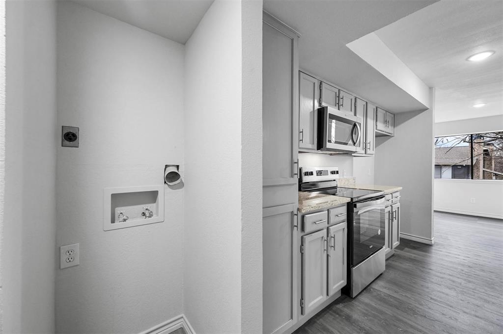 9825 Walnut Street, Unit 206 Dallas, TX 75243 - Photo 13 of 33 a kitchen with stainless steel appliances granite countertop a stove top oven a sink and dishwasher
