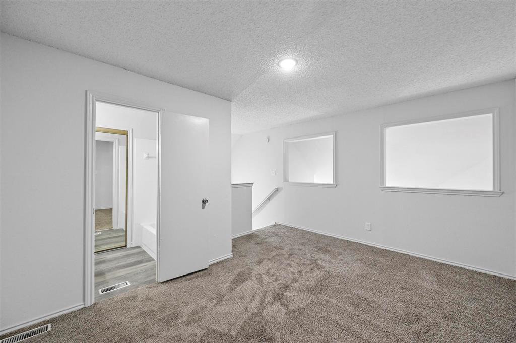 9825 Walnut Street, Unit 206 Dallas, TX 75243 - Photo 22 of 33 a view of empty room