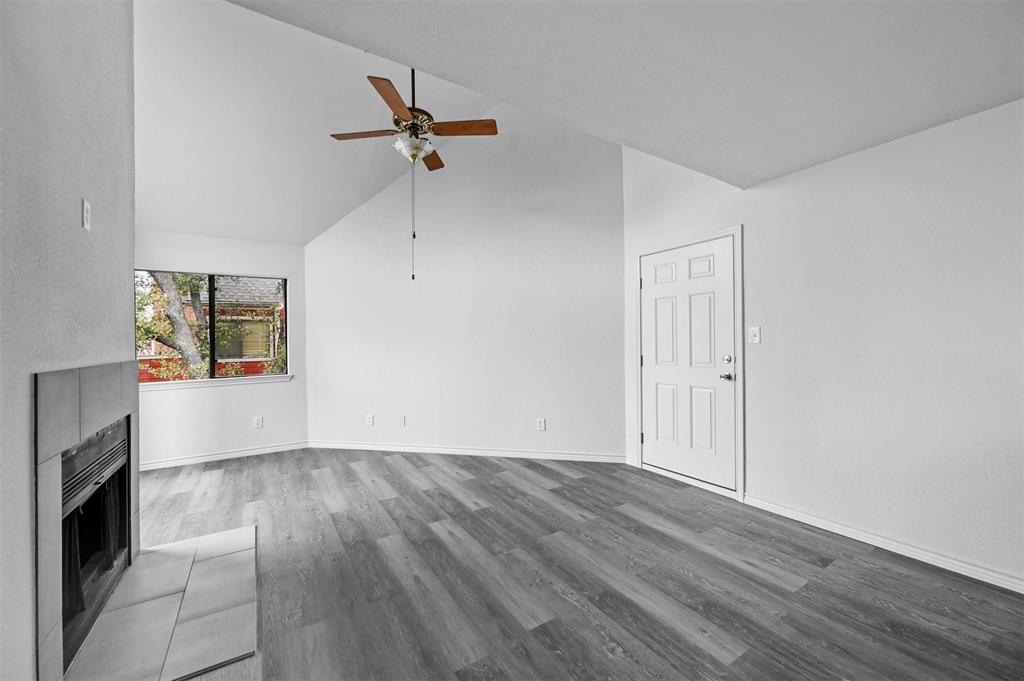 9825 Walnut Street, Unit 206 Dallas, TX 75243 - Photo 29 of 33 a view of empty room with wooden floor and fan