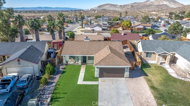 an aerial view of a house with a garden