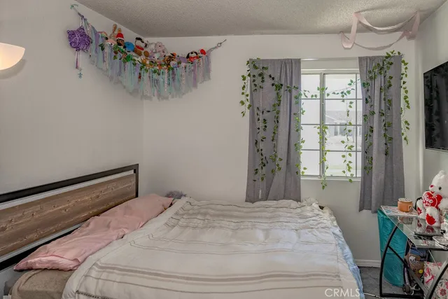 a bedroom with a bed and a table