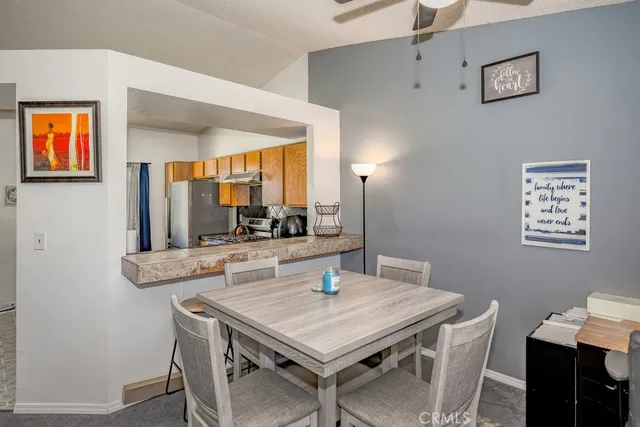 a kitchen with a table and chairs in it
