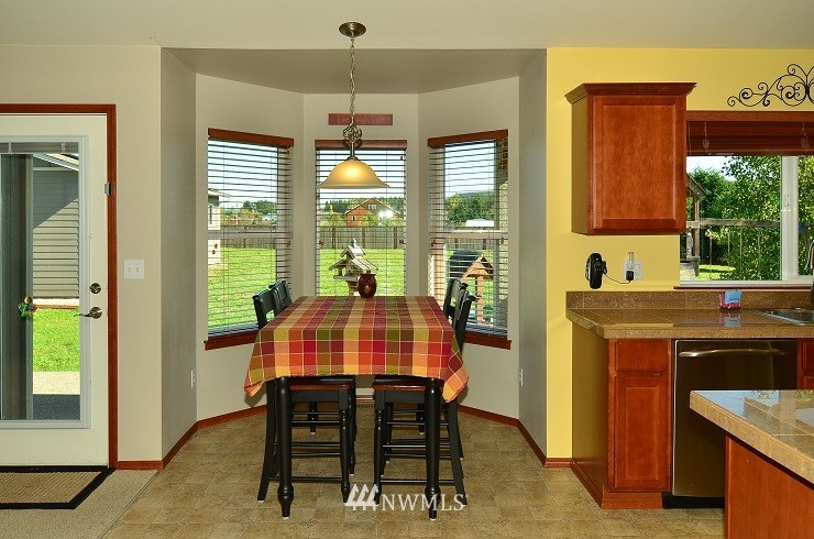 18110 Joseph Drive Southwest Rochester, WA 98579 - Photo 11 of 25 a view of a dining room with furniture window and outside view