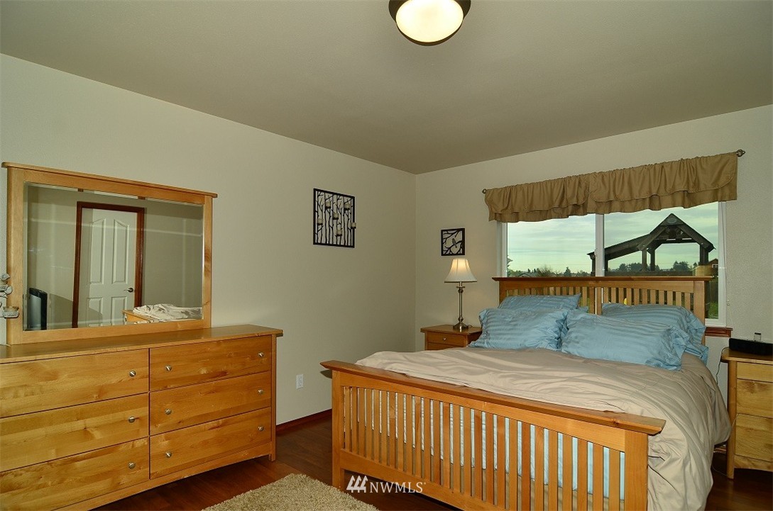 18110 Joseph Drive Southwest Rochester, WA 98579 - Photo 14 of 25 a bedroom with a bed and a window