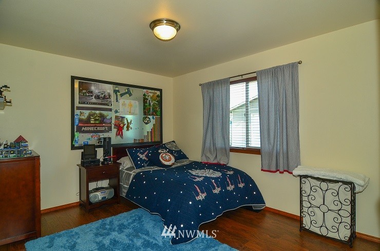 18110 Joseph Drive Southwest Rochester, WA 98579 - Photo 16 of 25 a bed sitting in a bedroom next to a window