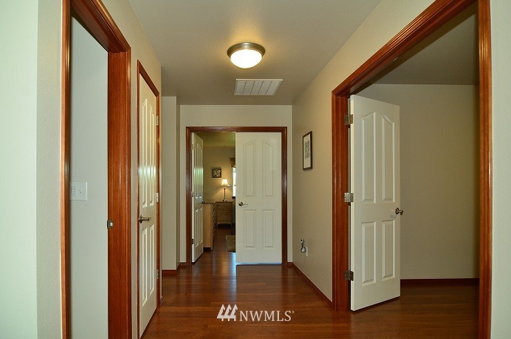 18110 Joseph Drive Southwest Rochester, WA 98579 - Photo 3 of 25 a view of a hallway with wooden floor and closet area