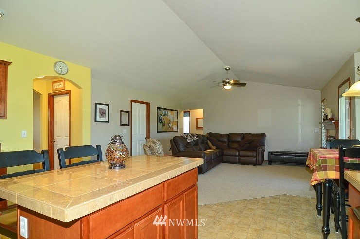 18110 Joseph Drive Southwest Rochester, WA 98579 - Photo 8 of 25 a living room with furniture and a table