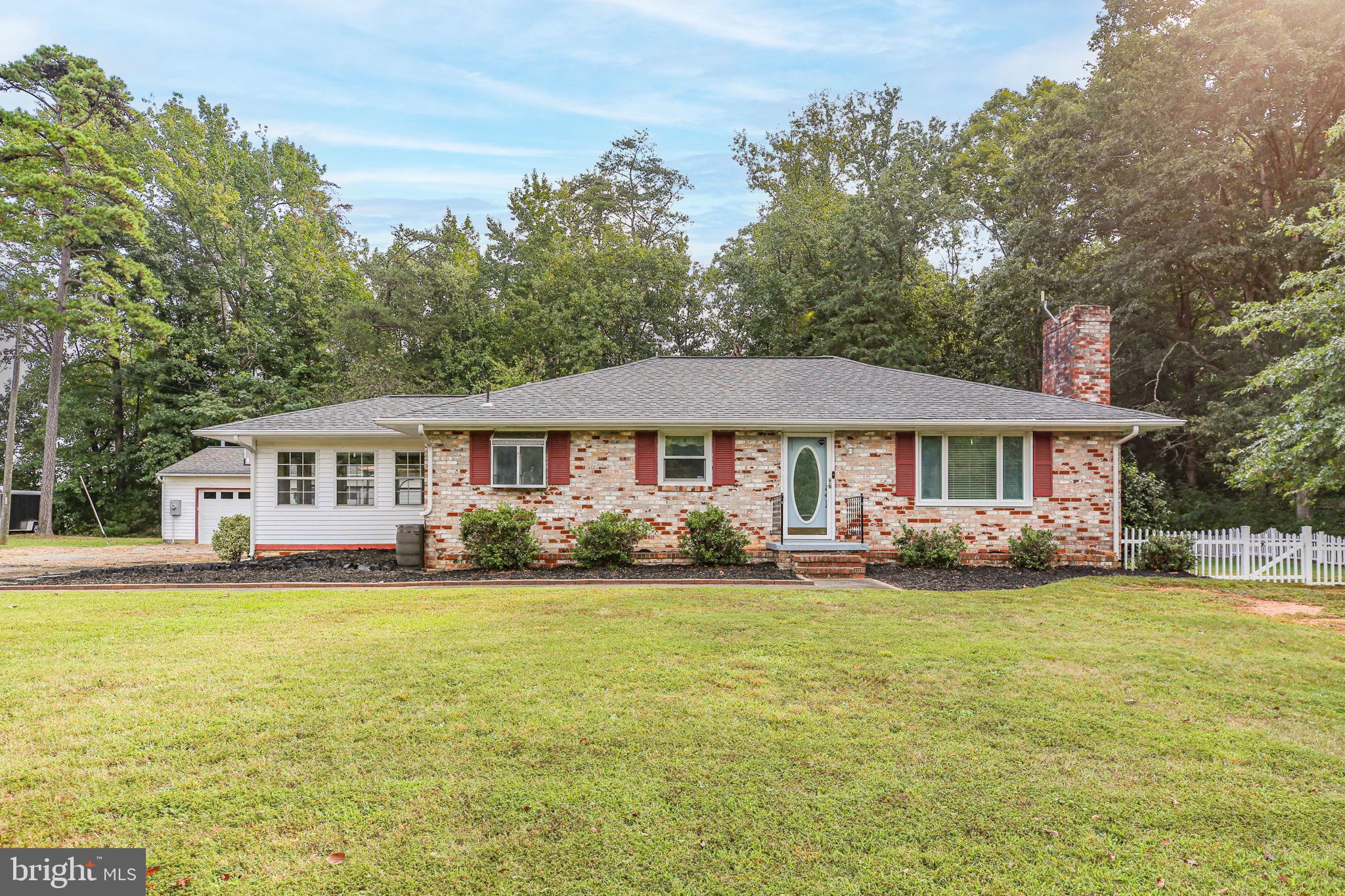 9416 Marye Road Partlow, VA 22534 - Photo 1 of 31 Charming brick home nestled in lush greenery.