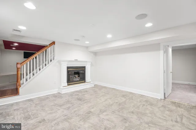en view interior of a house with stairs and a fireplace