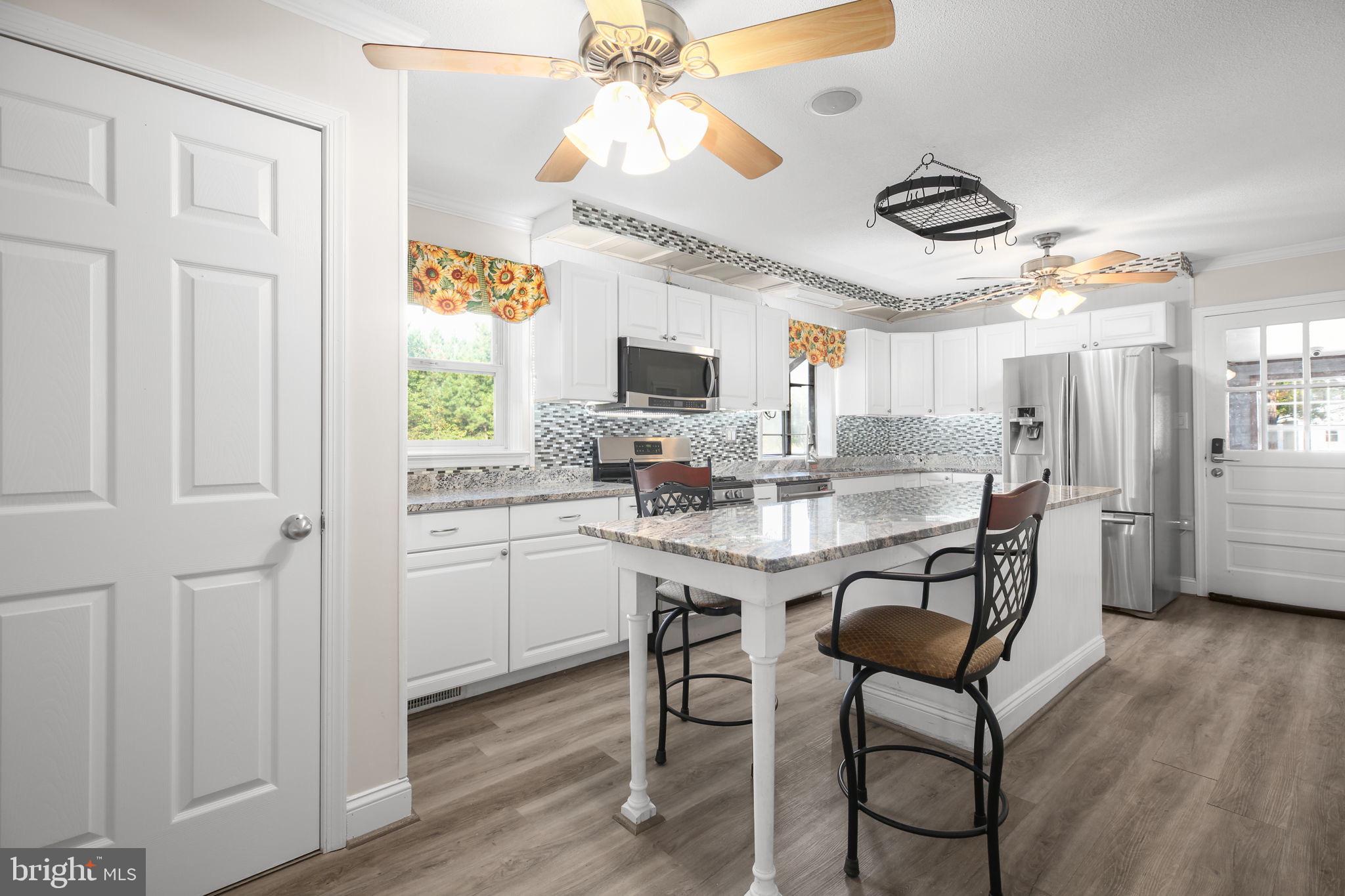 9416 Marye Road Partlow, VA 22534 - Photo 6 of 31 Bright and airy kitchen with modern charm.