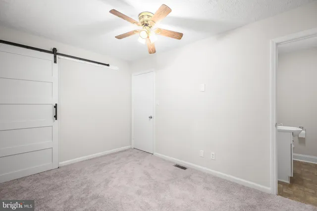a view of a chandelier fan in a room