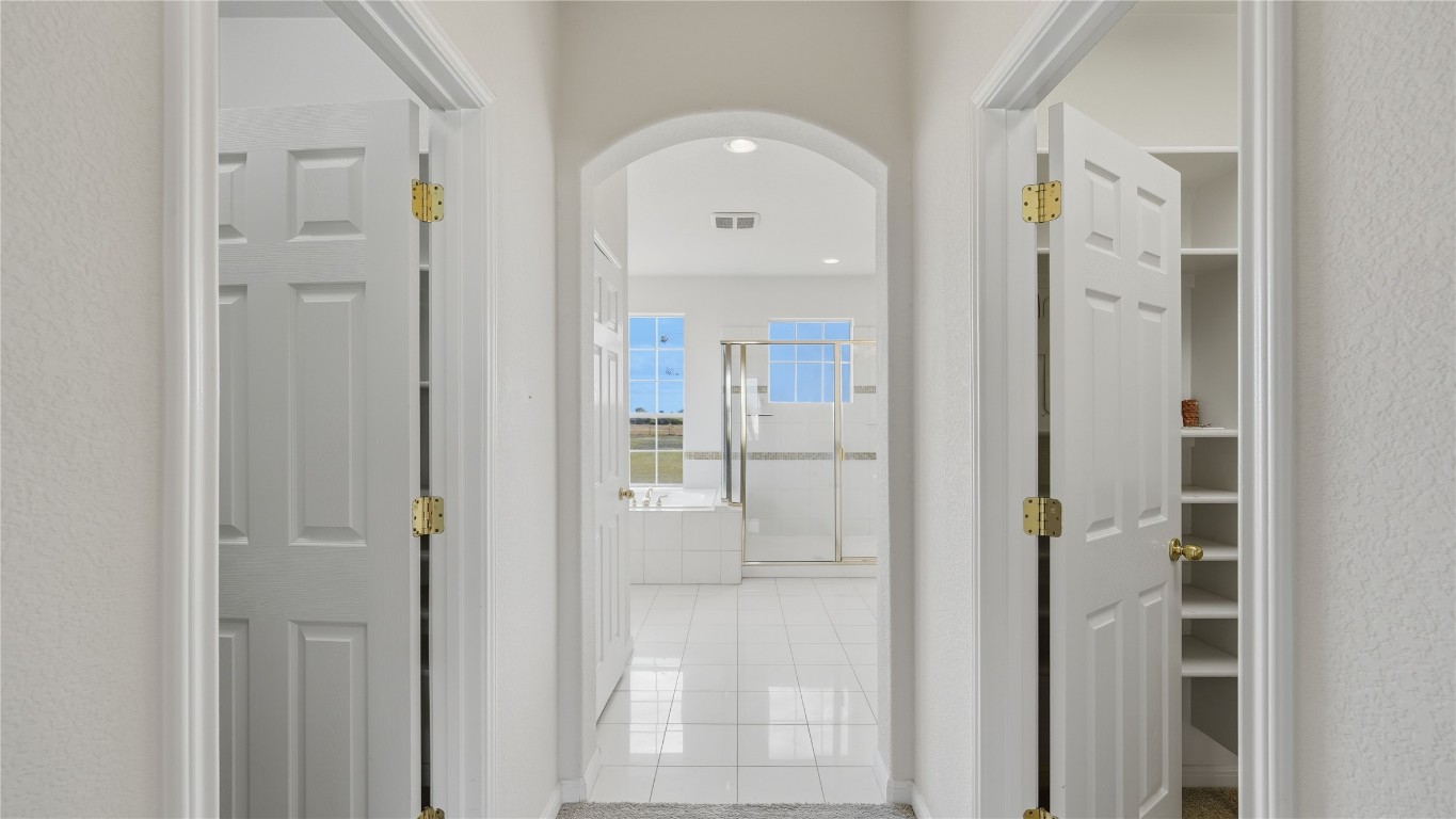 15620 Harry Lind Road Manor, TX 78653 - Photo 18 of 40 a view of a hallway with wooden floor