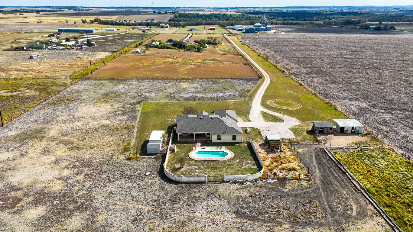 15620 Harry Lind Road Manor, TX 78653 - Photo 5 of 40 an aerial view of a swimming pool with outdoor seating