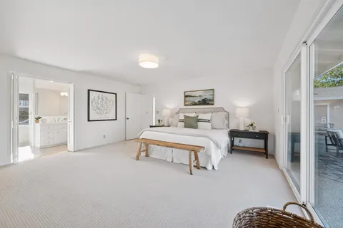 a bedroom with a bed and a view of bedroom