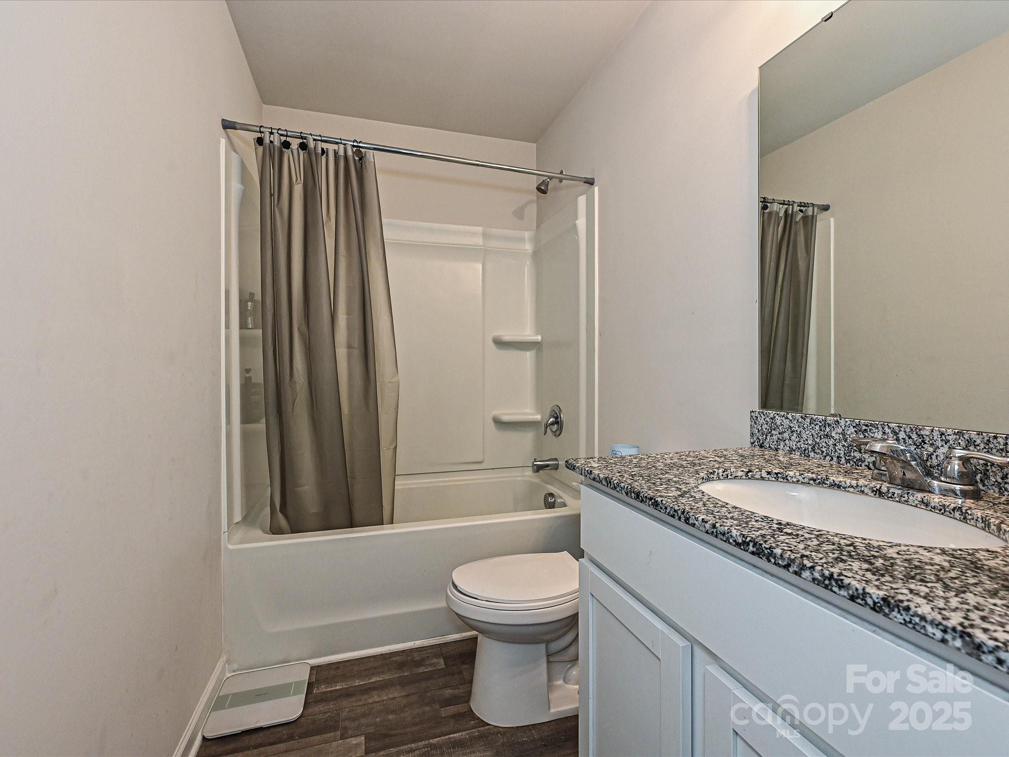 323-j C J C Dellinger Road Cherryville, NC 28021 - Photo 19 of 29 a bathroom with a granite countertop sink toilet a mirror and shower