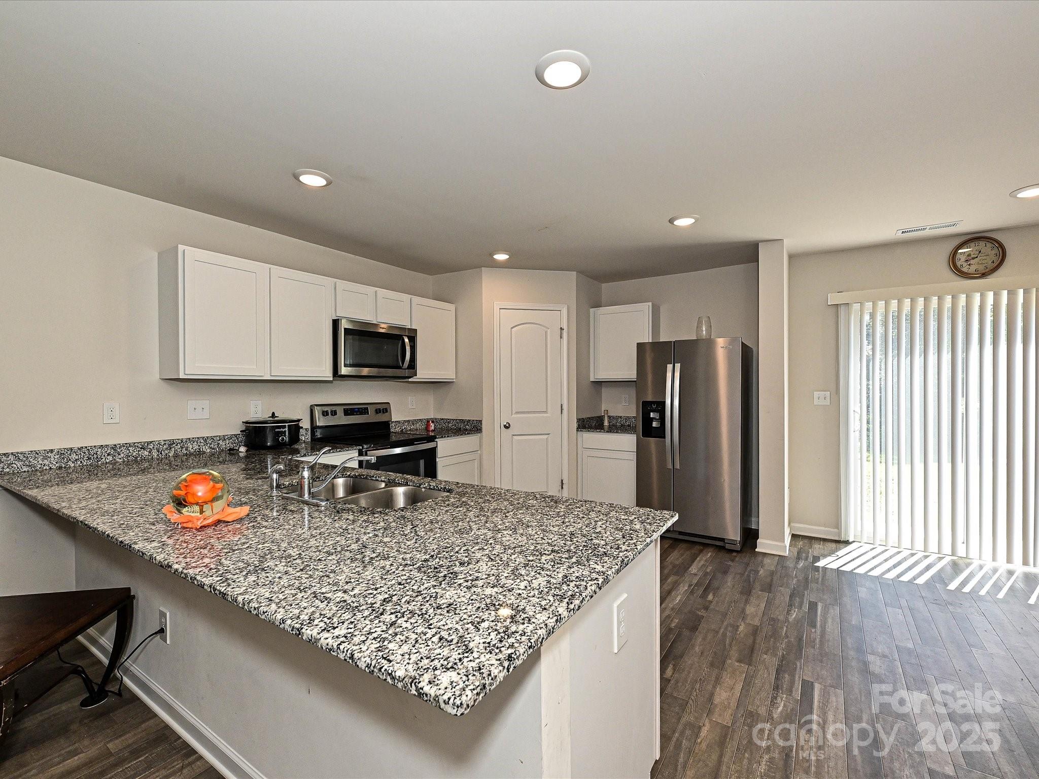 323-j C J C Dellinger Road Cherryville, NC 28021 - Photo 4 of 29 a kitchen with stainless steel appliances granite countertop a sink refrigerator and microwave