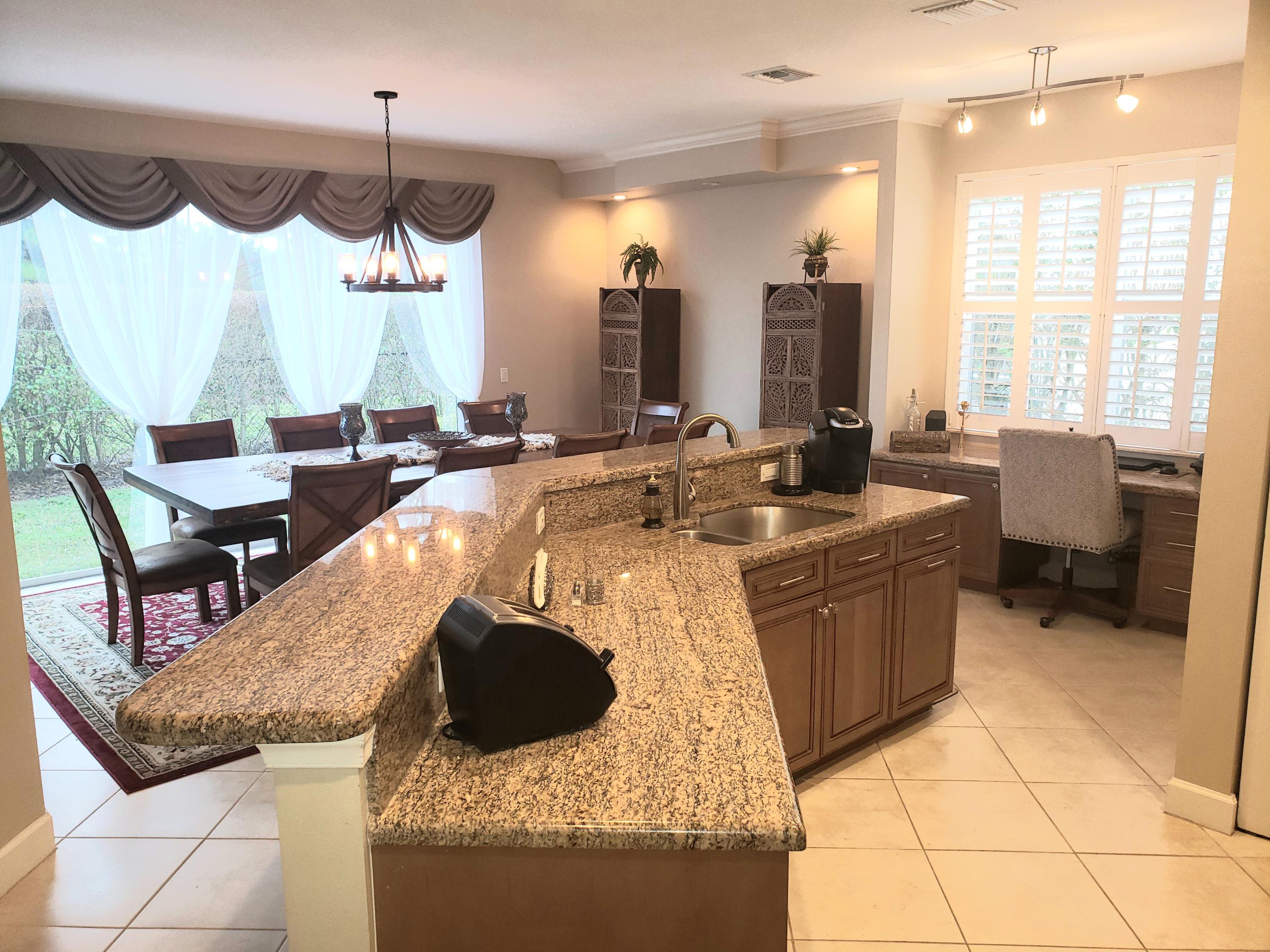 610 Scrubjay Drive Jupiter, FL 33458 - Photo 10 of 29 f6f4838c0b87-kitchen_dining_office