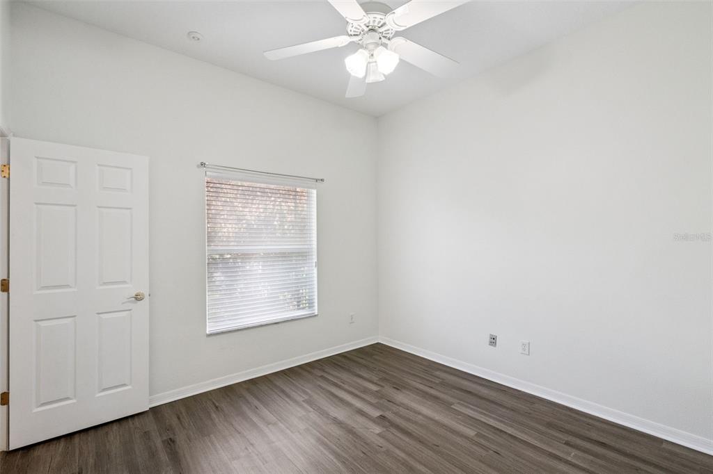2541 Teton Stone Run Orlando, FL 32828 - Photo 45 of 82 an empty room with wooden floor closet and windows