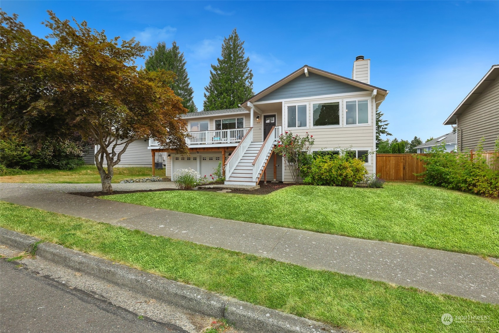 4114 Northeast 22nd Place Renton, WA 98059 - Photo 1 of 28 a front view of a house with a yard