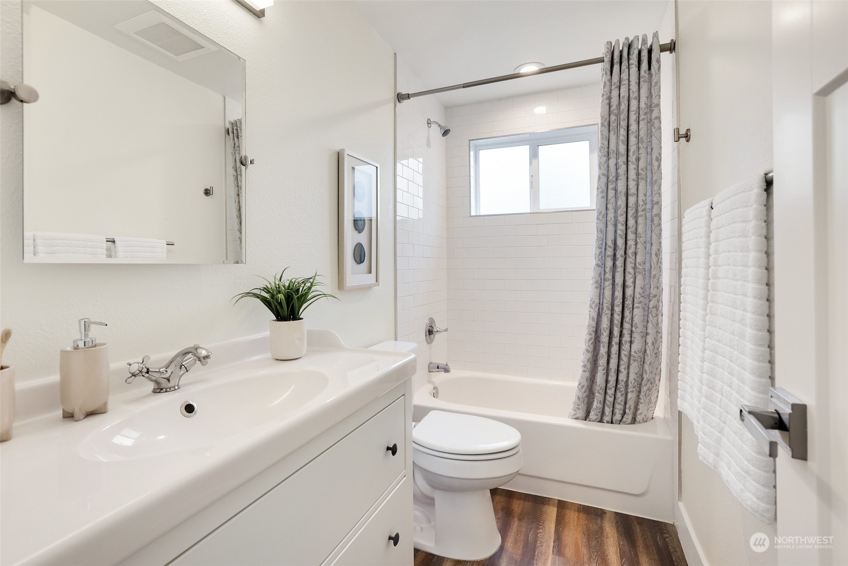 4114 Northeast 22nd Place Renton, WA 98059 - Photo 11 of 28 a bathroom with a sink a toilet and shower