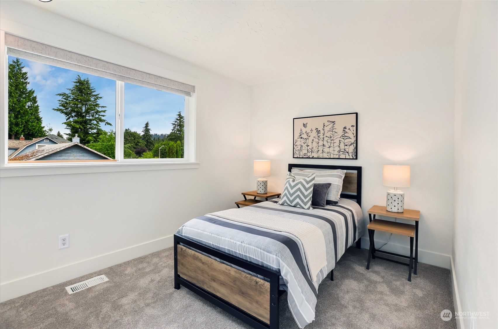 4114 Northeast 22nd Place Renton, WA 98059 - Photo 12 of 28 a bedroom with a bed and a window