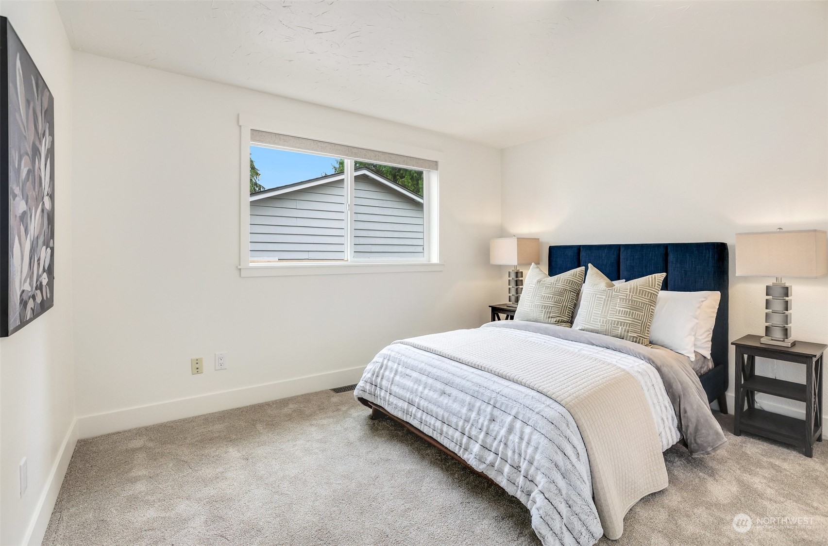 4114 Northeast 22nd Place Renton, WA 98059 - Photo 13 of 28 a bedroom with a bed and a window