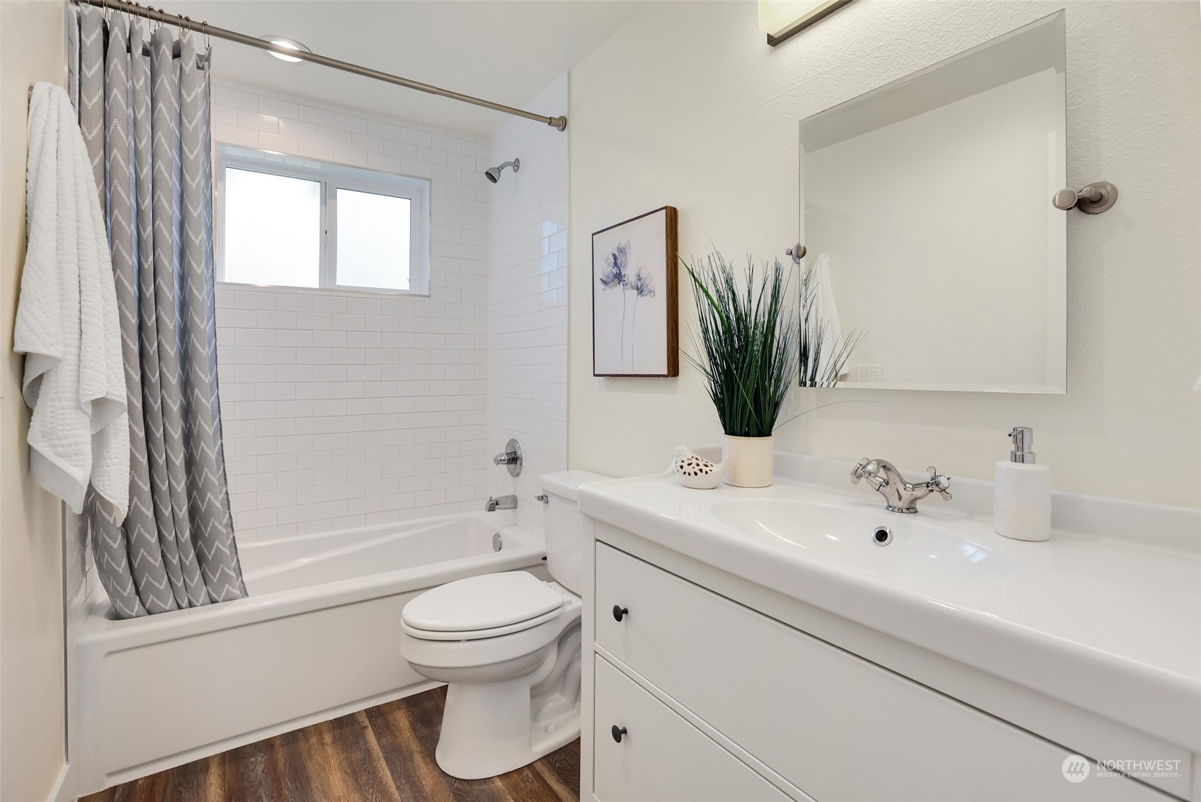 4114 Northeast 22nd Place Renton, WA 98059 - Photo 14 of 28 a bathroom with a toilet a sink a tub and mirror