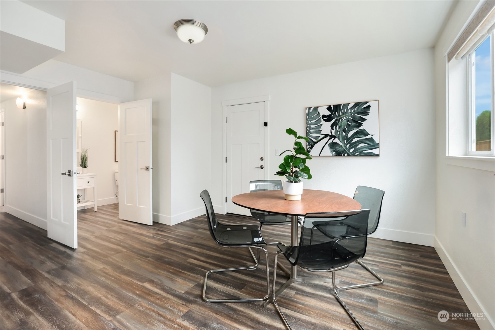 4114 Northeast 22nd Place Renton, WA 98059 - Photo 18 of 28 a view of a dining room with furniture and wooden floor