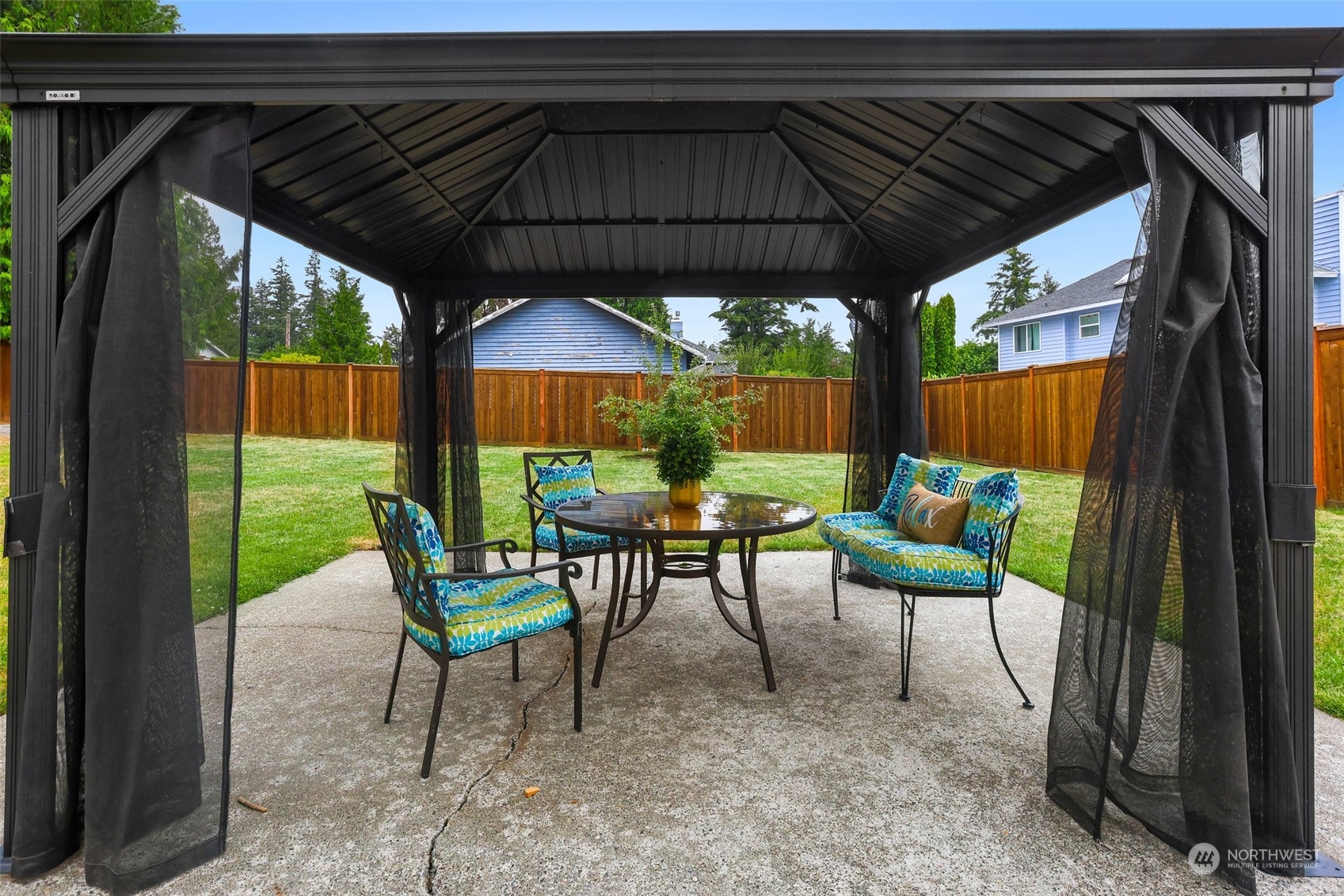 4114 Northeast 22nd Place Renton, WA 98059 - Photo 25 of 28 a view of chair and table in the patio next to a yard