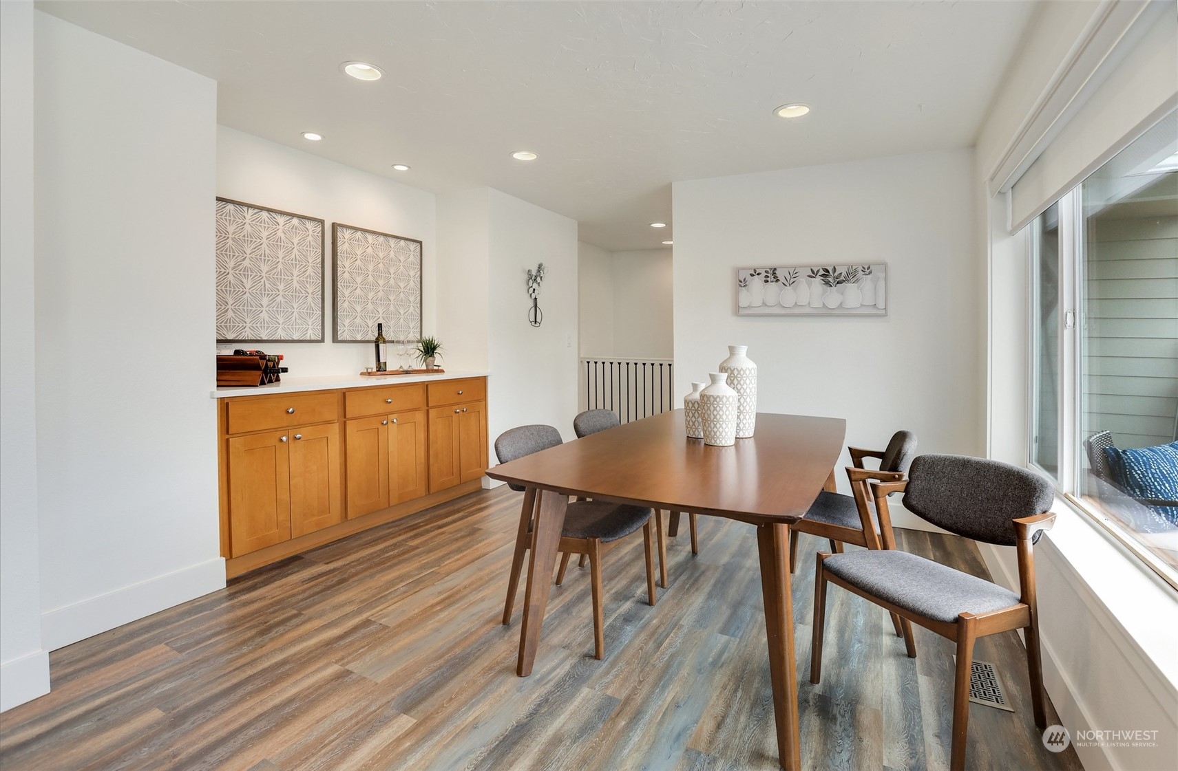 4114 Northeast 22nd Place Renton, WA 98059 - Photo 6 of 28 a view of a dining room with furniture and wooden floor