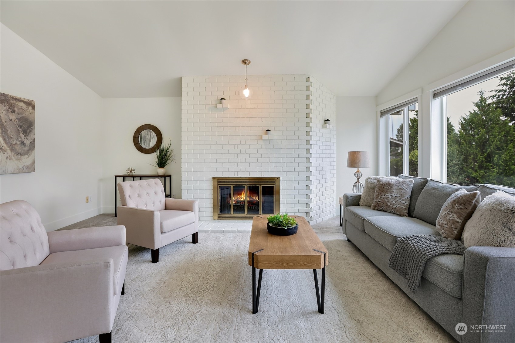 4114 Northeast 22nd Place Renton, WA 98059 - Photo 9 of 28 a living room with furniture and a fireplace