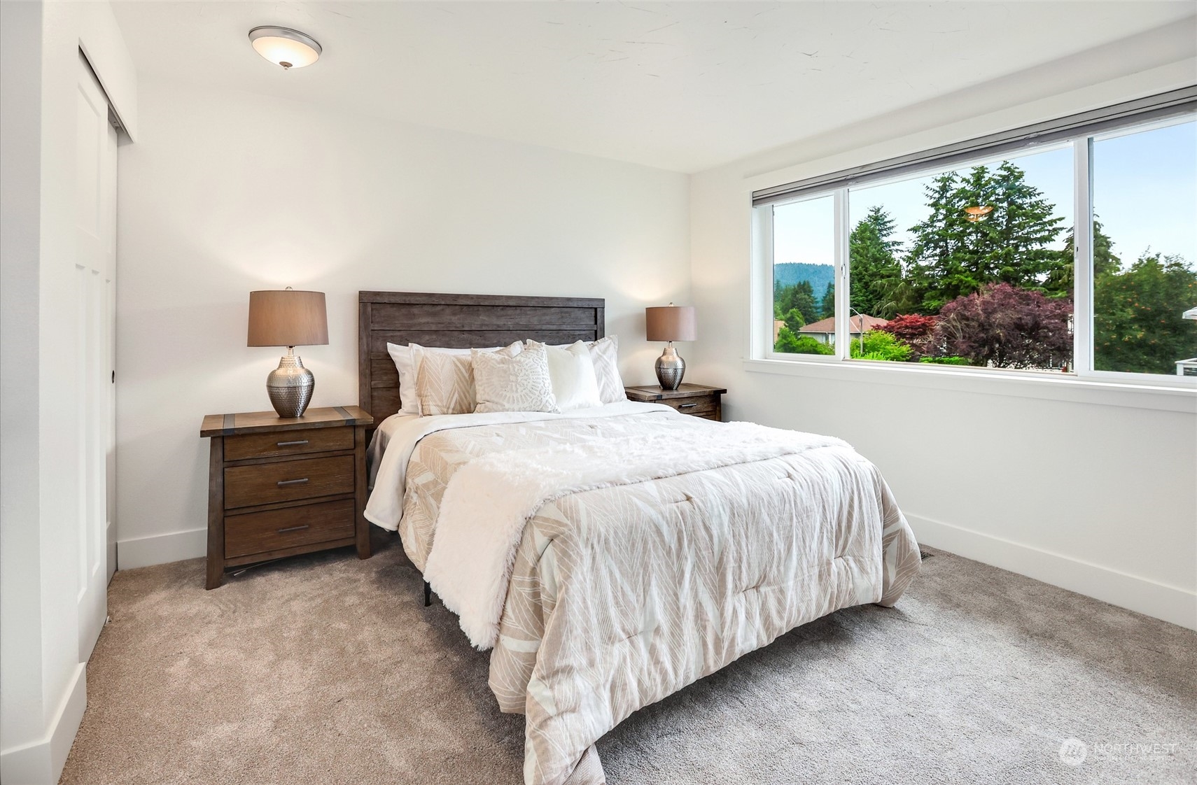4114 Northeast 22nd Place Renton, WA 98059 - Photo 10 of 28 a bed room with a bed and a night stand