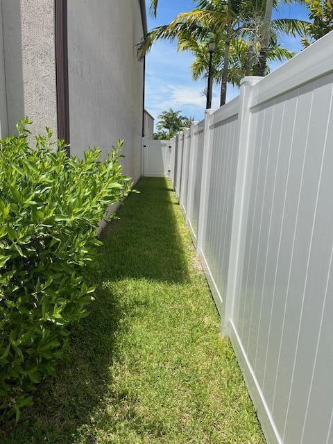 2999 Butternut Lane Riviera Beach, FL 33410 - Photo 11 of 52 Side fence