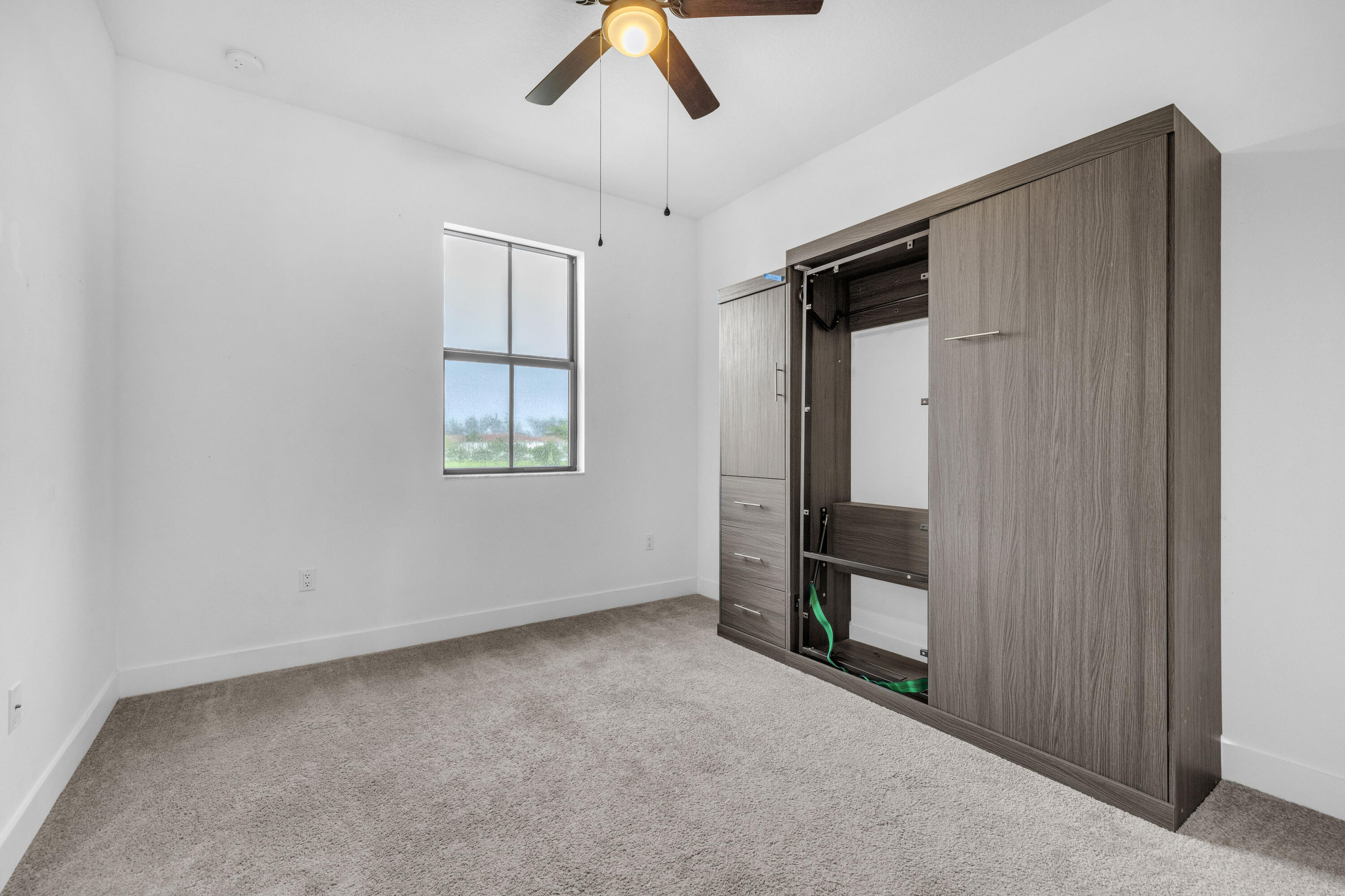 2999 Butternut Lane Riviera Beach, FL 33410 - Photo 30 of 52 Bedroom with murphy bed