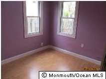 122 Breton Road Brick, NJ 08723 - Photo 5 of 12 a view of an empty room with a window