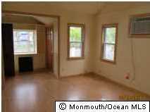 122 Breton Road Brick, NJ 08723 - Photo 8 of 12 a view of an empty room and window
