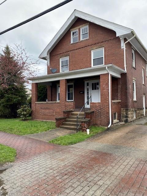 1153 Church Street Indiana, PA 15701 - Photo 2 of 11 a front view of a house with a yard and garage